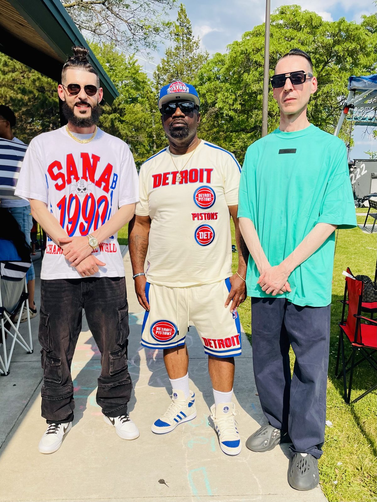 KING T and LUSS with a friend in Pistons gear at a park