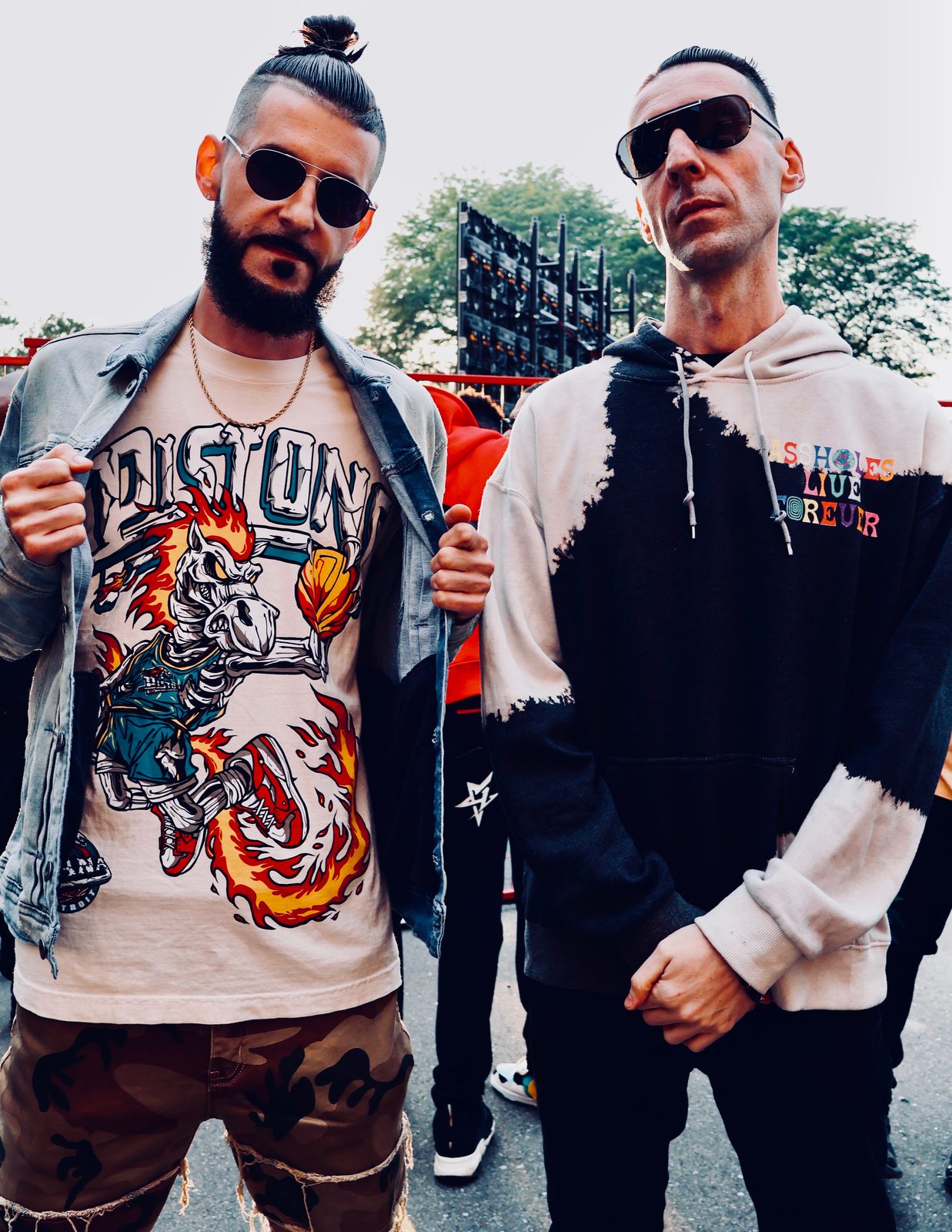 KING T and LUSS posing in sunglasses on the street