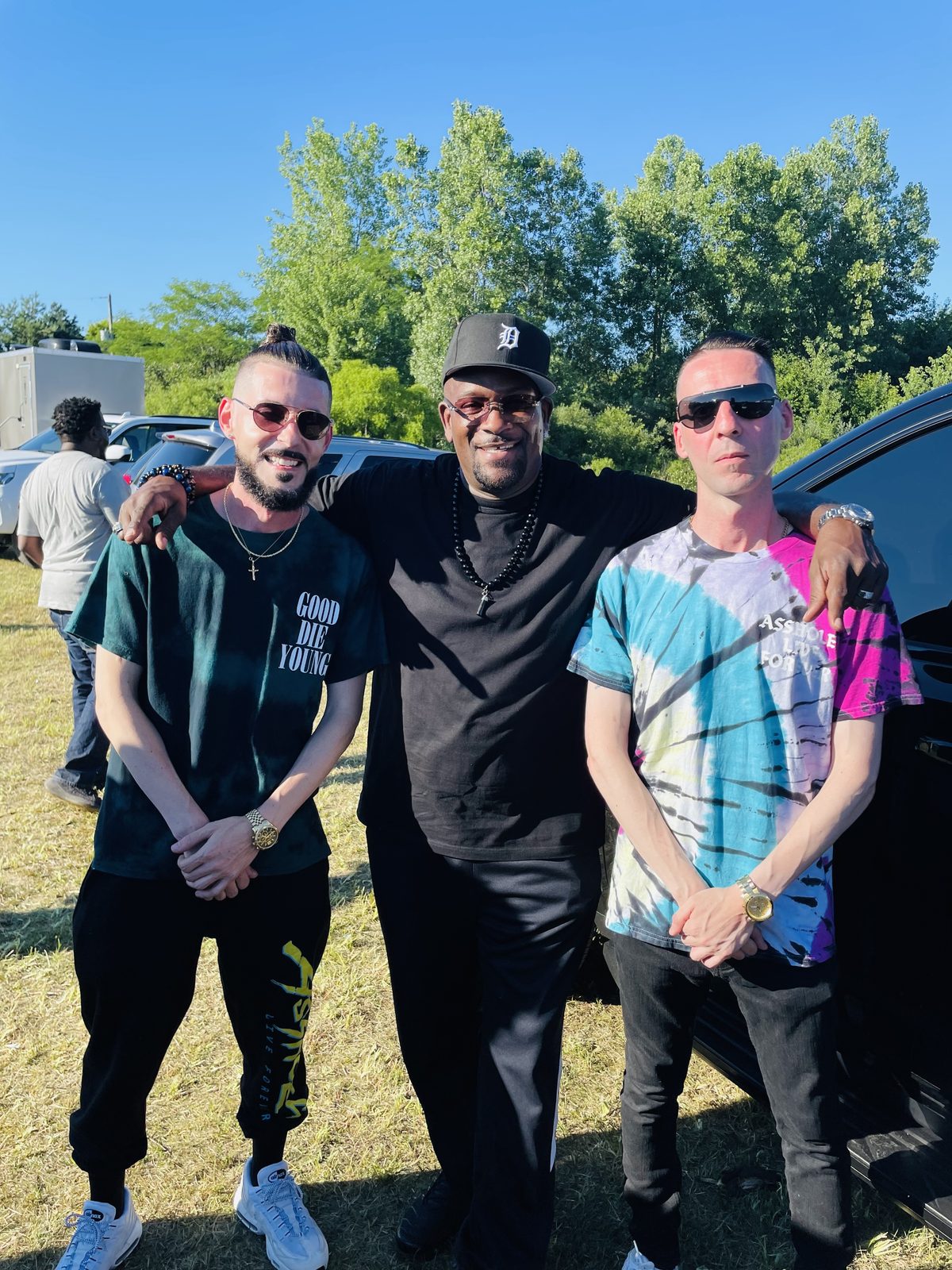 KING T and LUSS with friends at an outdoor festival