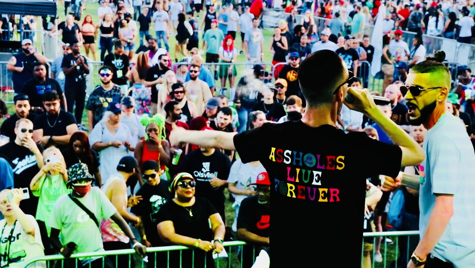 A TNL performer facing a big festival crowd from the stage